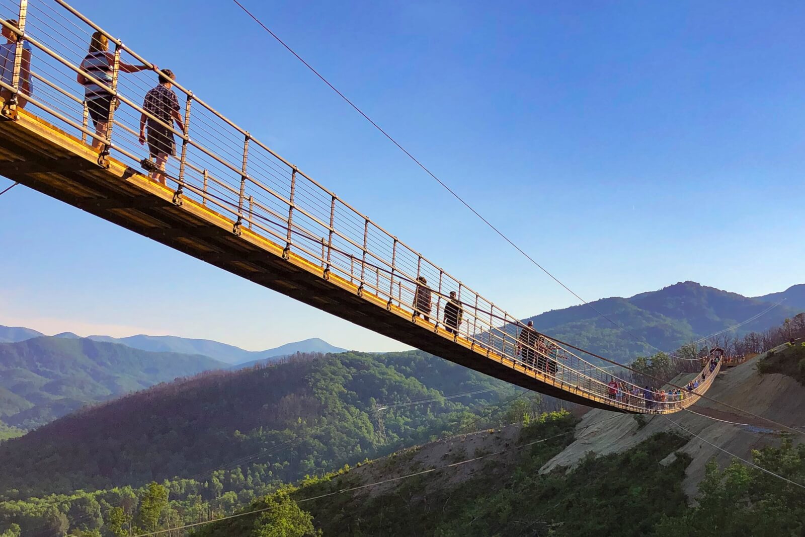 People walking across the SkyBridge in Gatlinburg, TN