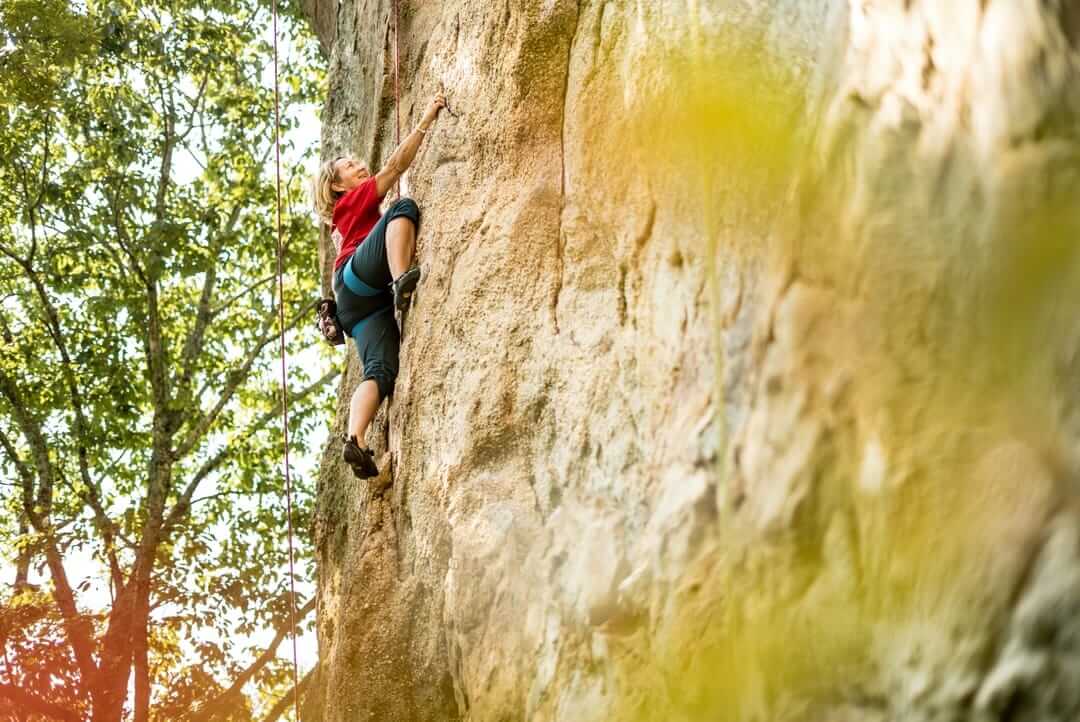 rock climber on side of rock formation