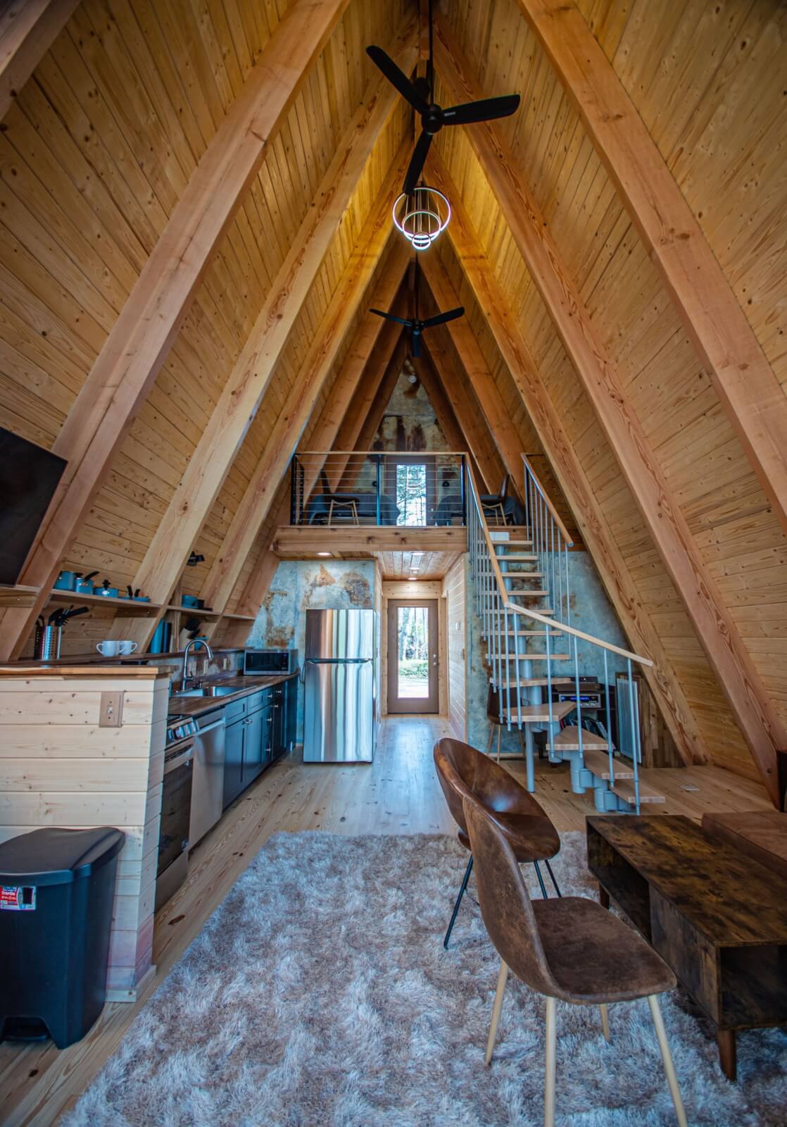 Cozy interior of A-frame cabin rental.