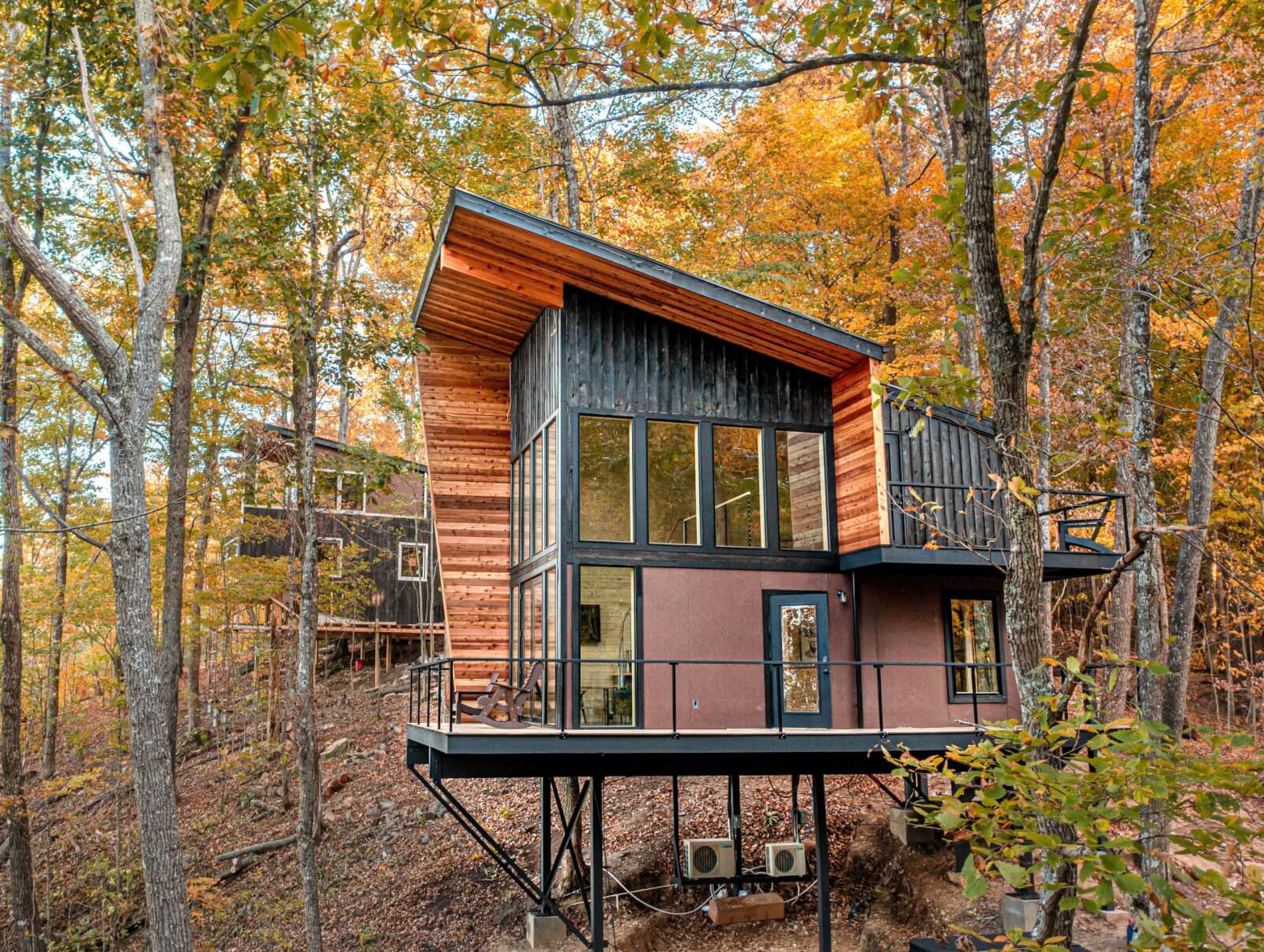 Exterior of Tree Lofts 1 rental property in the forest.