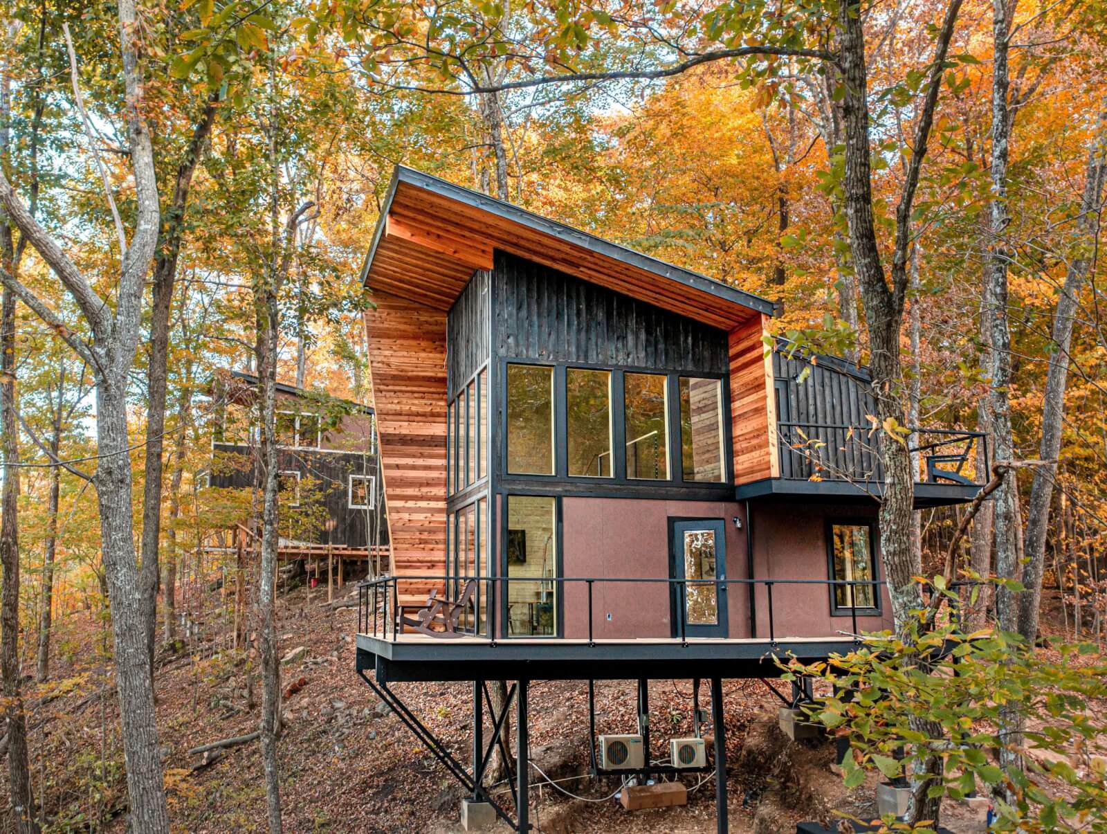 Exterior of Tree Lofts 1 rental property in the forest.